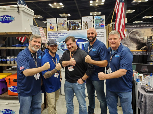 Retired Navy SEAL, Thomas "Drago" Dzerian (center) and the ICEY-TEK staff in front of the ICEY-TEK ice chest cooler booth at ATA 2020